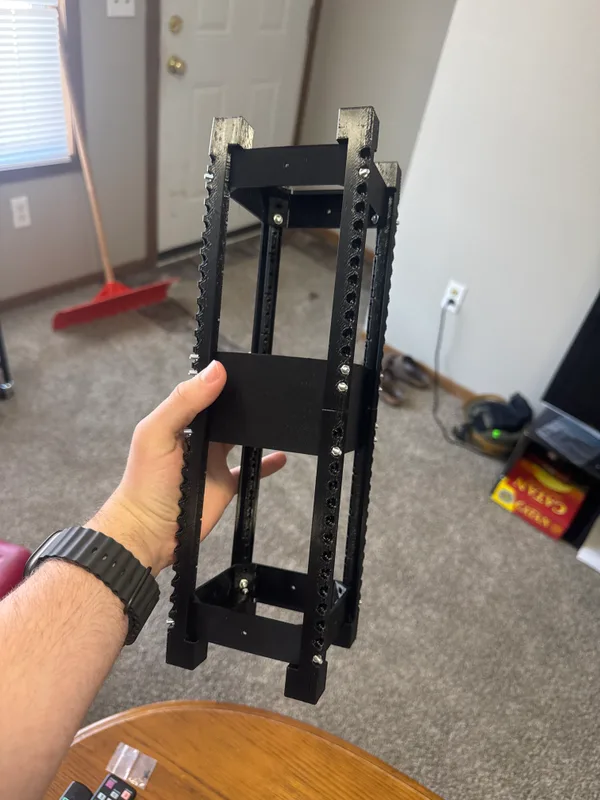 Assembled black Destination Dirt frame before exterior panels, showing its rails and internal mounting features.