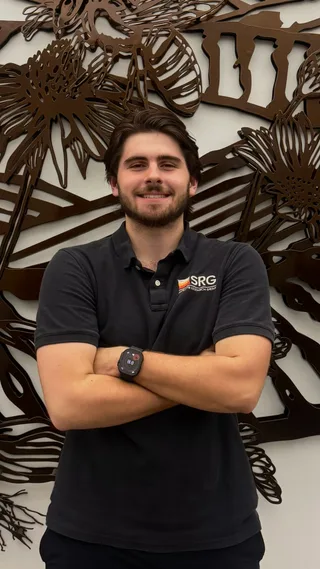 Portrait of Will Wilson wearing an SRG polo shirt.